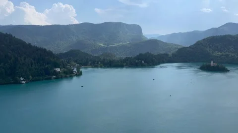 Lake Bled after rain with island church and alpine mountain landscape in Sloveni Video stock 343264380