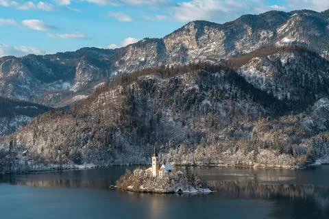 Lake Bled in winter with a beautiful view of the island with the church and.. Stock Photos