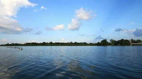 Lake with blue sky and clouds reflected in water,Time lapse clip. Stock Footage 45457952