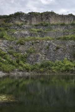 Lake a the bottom of quarry Stock Photos
