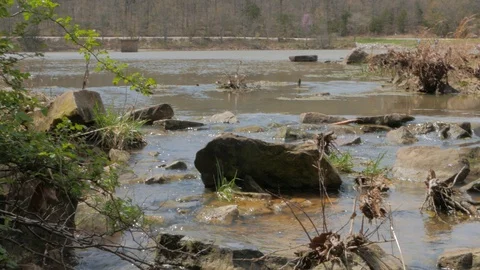 Lake Breaking Off Into a River Stock Footage 127949356