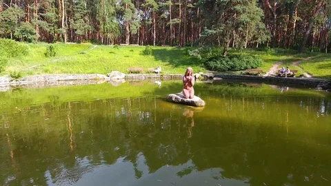 Lake with a bronze statue in the park. Stock Footage 112888360