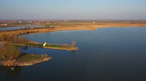 Lake with cane sun wind kite beautiful aerial shot Stock Footage 47930053