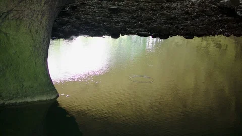 A lake in a cave system and wind making ripples Stock Footage 89605639