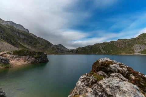Lake, clouds and rocks with text space, long exposure Foto stock