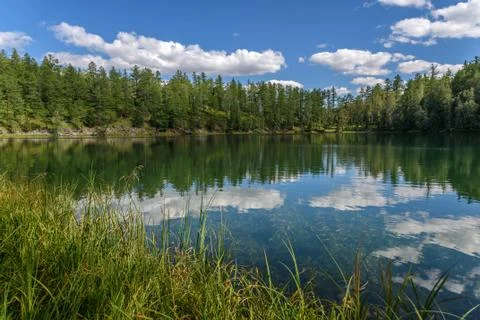 Lake clouds forest reflections summer Stock Photos