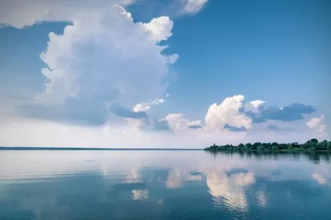 Lake with clouds reflected in the water Stock Photos