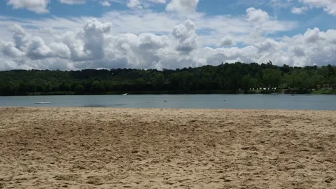 Lake with cloudy sky, pollen particles in suspension, calm scene Stock Footage 154398721