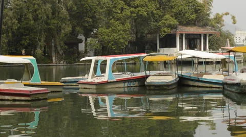 On the lake, colored boat Stock Footage 35535665