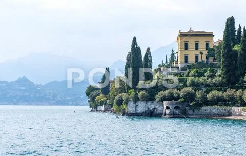 Lake Como, mountains and villa on shore Stock Photos