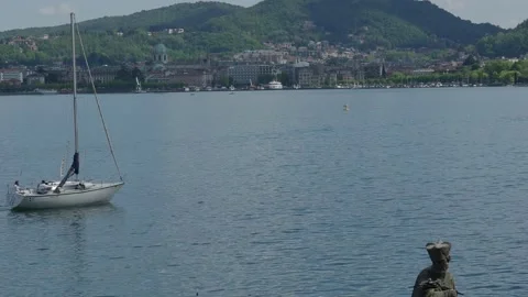 Lake Como, sailboat returns to the harbor at dusk. Stock Footage 153517705