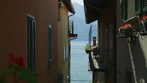 Lake Como seen between buildings in Varenna, Lombardy,Italy Vídeo Stock 251825265
