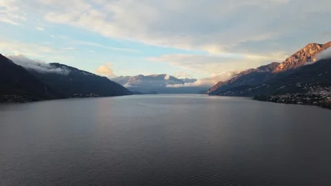 Lake Como, surrounded by mountains, at sunset in Lombardy, Italy Stock Footage 320307457