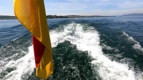 Lake Constance on a German flag excursion boat and blue water with sailing .. Stock Footage 240925690