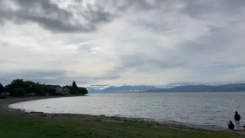 Lake Constance Germany Langenargen Beach Mountains houses beautiful Scenic Cloud Stock Footage 317911027