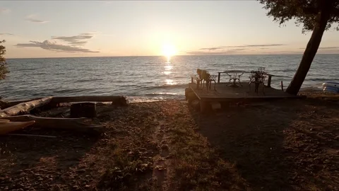 Lake cottage sunset on a deck Video stock 150754299