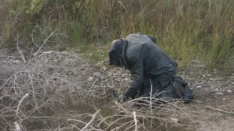 Lake creature warlock drinking from lagoon Stock Footage 209669646