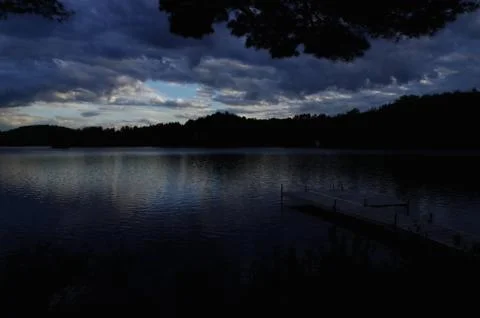 Lake in the darkness Stock Photos