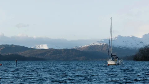 Lake District England Windermere boat snow topped mountains Stock Footage 86891253