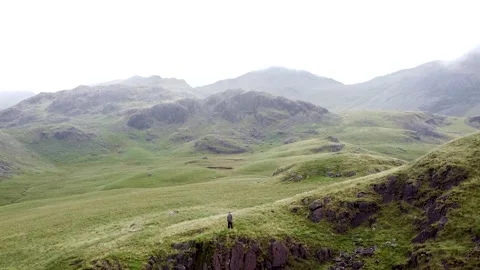 Lake District Landscape Drone, Man on Cliff Stock Footage 137865002