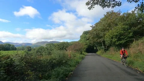 Lake District View from inside car passing cyclists Video stock 219047763