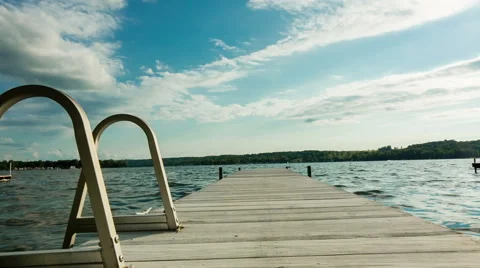 Lake Dock with Ladder Pull Back and Move Forward Stock Footage 57753233