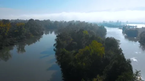 Lake at the edge of the mountains with forest reflected in the clear water Stock-Footage 150558761