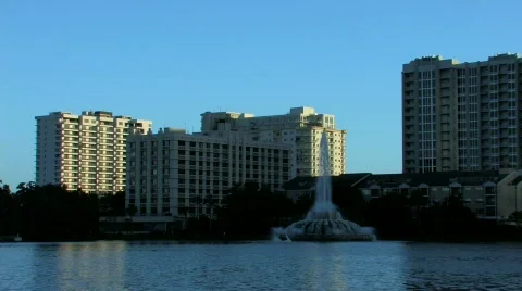 Lake Eola Park and Orlando skyline in late evening Stock Footage