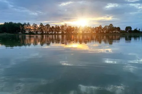 By the lake in the evening at sunset Stock Photos