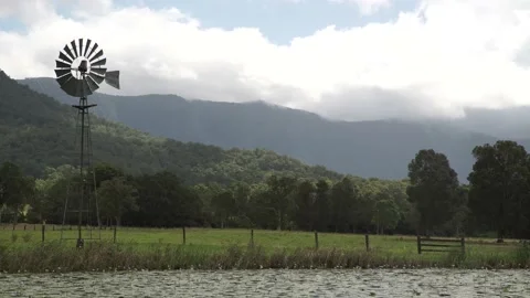 LAKE ON FARM WITH WINDMILL Stock Footage 157947042