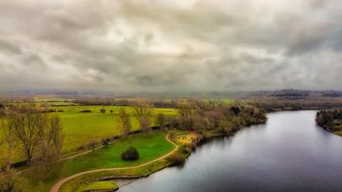 Lake with fields in Autumn Stock Photos