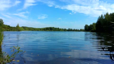 Lake in the forest in summer. The sky is reflected in the water. Stock-Footage 204718652