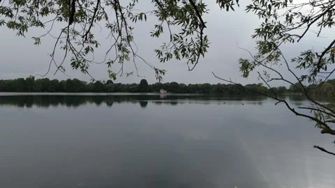 Lake Framed By Overhanging Tree Branches Aerial Vídeos de archivo 343025777