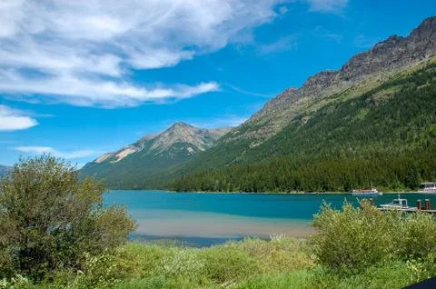 A lake in front of the mountains Stock Photos