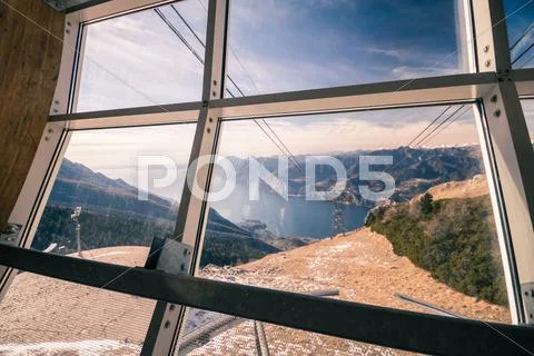 Lake Garda seen from the top station of the cableway. Stock Photos