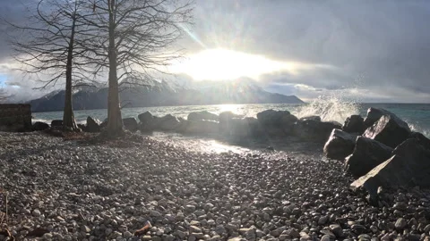 Lake Geneva stormy sunset with dramatic clouds and mountains 動画素材 329122709