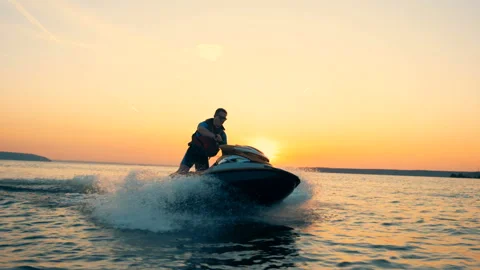 Lake is getting sailed through by a man on a watercraft Video stock 96879242