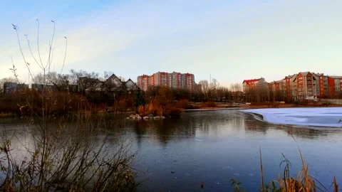 Lake half covered in ice with ducks Stock Footage 220501594