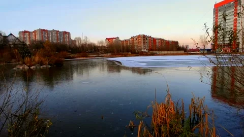 Lake half covered in ice with ducks Stock Footage 220501613
