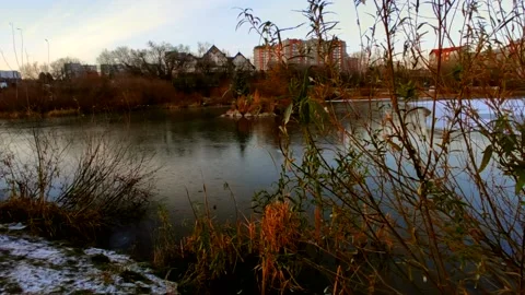 Lake half covered in ice with ducks Stock Footage 220501666