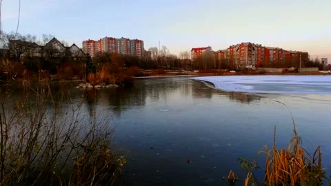 Lake half covered in ice with ducks Stock Footage 220502182