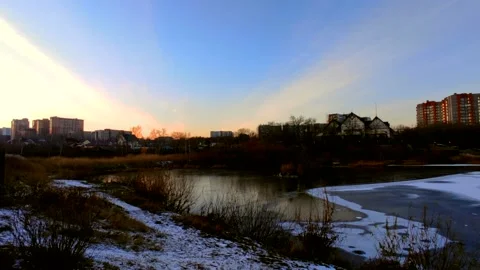 Lake half covered in ice with ducks Stock Footage 220502337