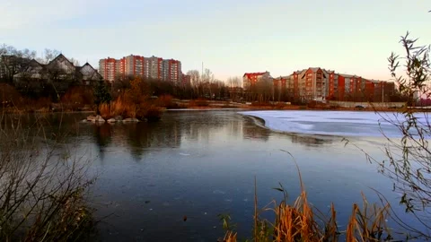 Lake half covered in ice with ducks Stock Footage 220502363
