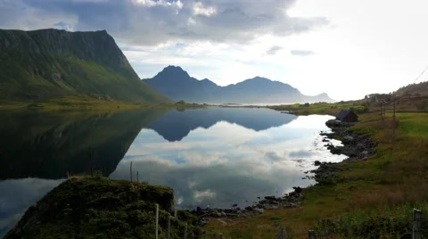 A lake that has a mirror in the mountains Stock Footage 67416434