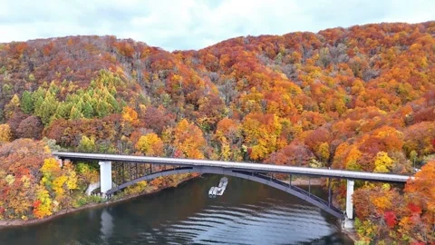 Lake Hibara Bridge and Sightseeing Boat Autumn Aerial Fukushima Stock Footage 329053296