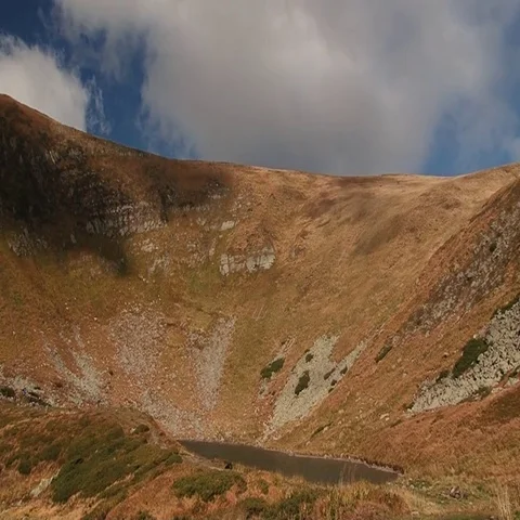 Lake in the hollow between the mountains Stock Footage 69519808