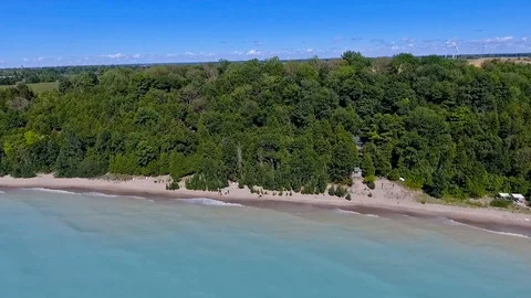 Lake Huron shoreline pull back drone aerial shot Stock Footage 124454087