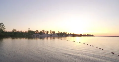 Lake island at sunset  Stockbeeldmateriaal 68895965