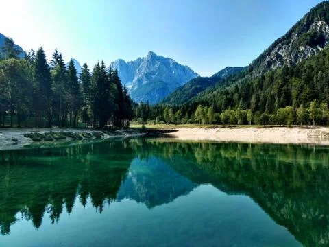 Lake Jasna, Slovenia reflecting a mountain Stock Photos