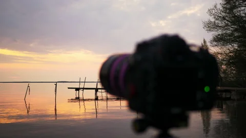 Lake landscape of camera with beautiful sunset in the evening on peaceful day Stock Footage 170449772